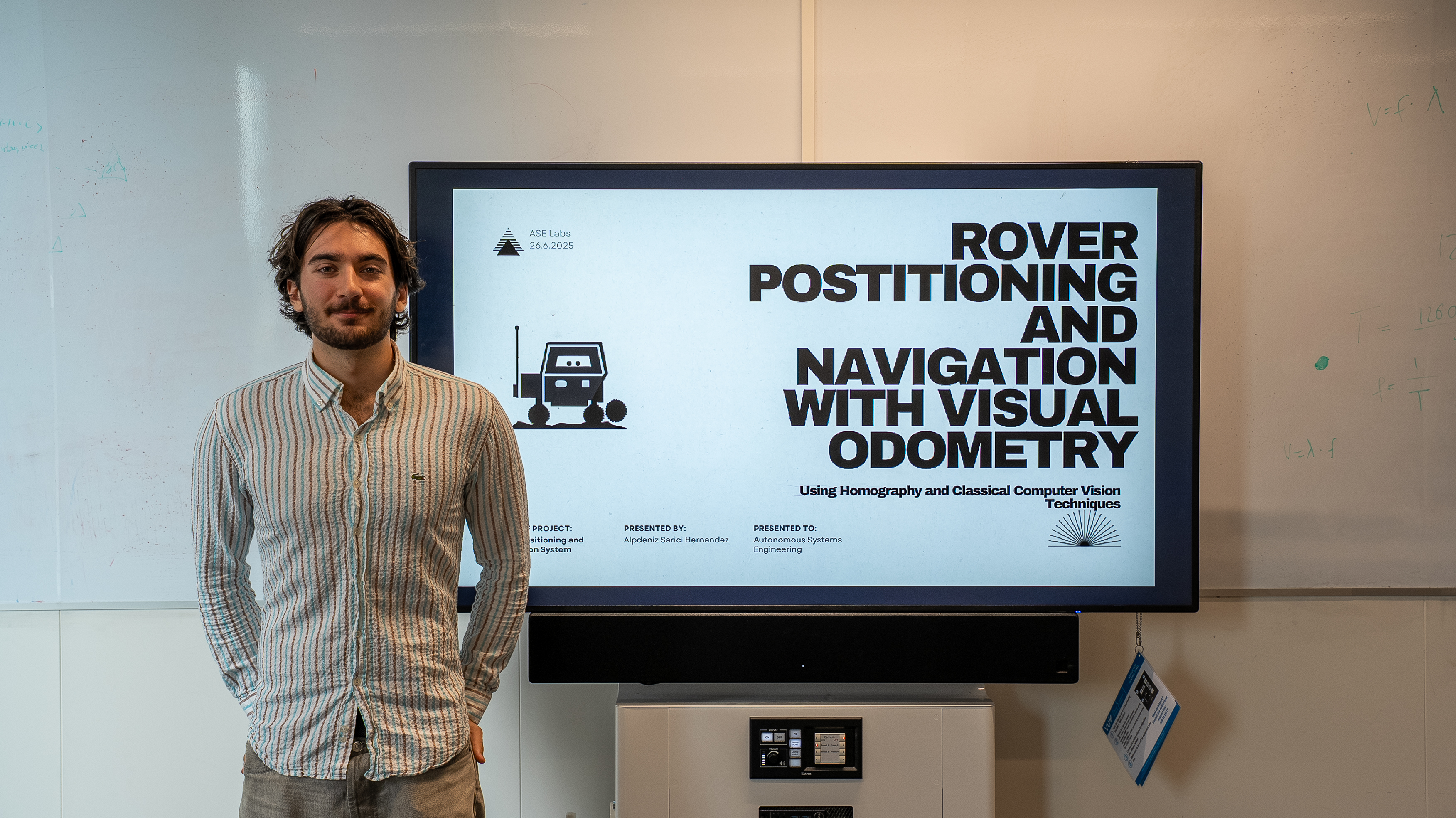 Alpdeniz standing in-front of title slide presentation picture