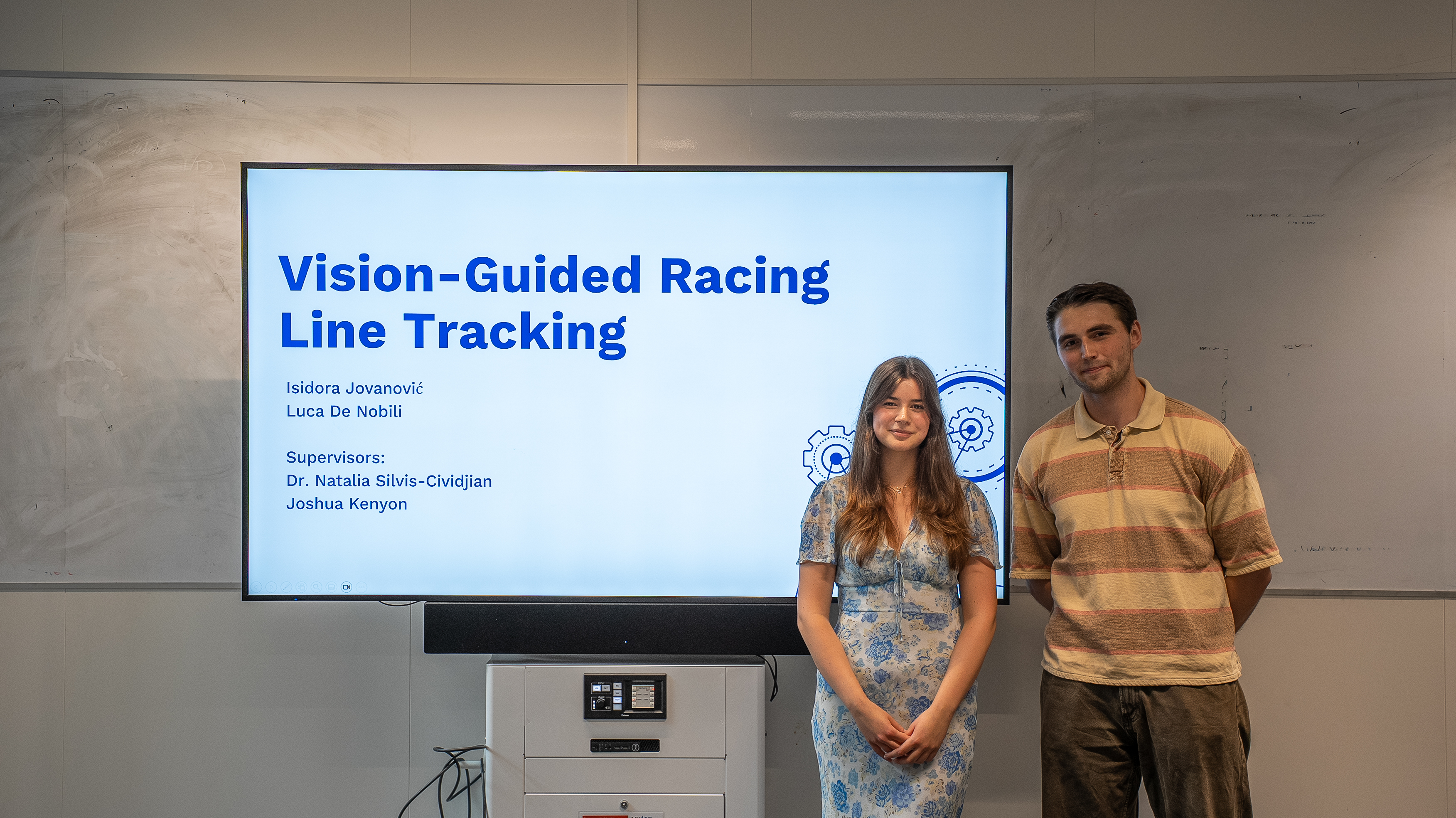 lucaisidora standing in-front of title slide presentation picture